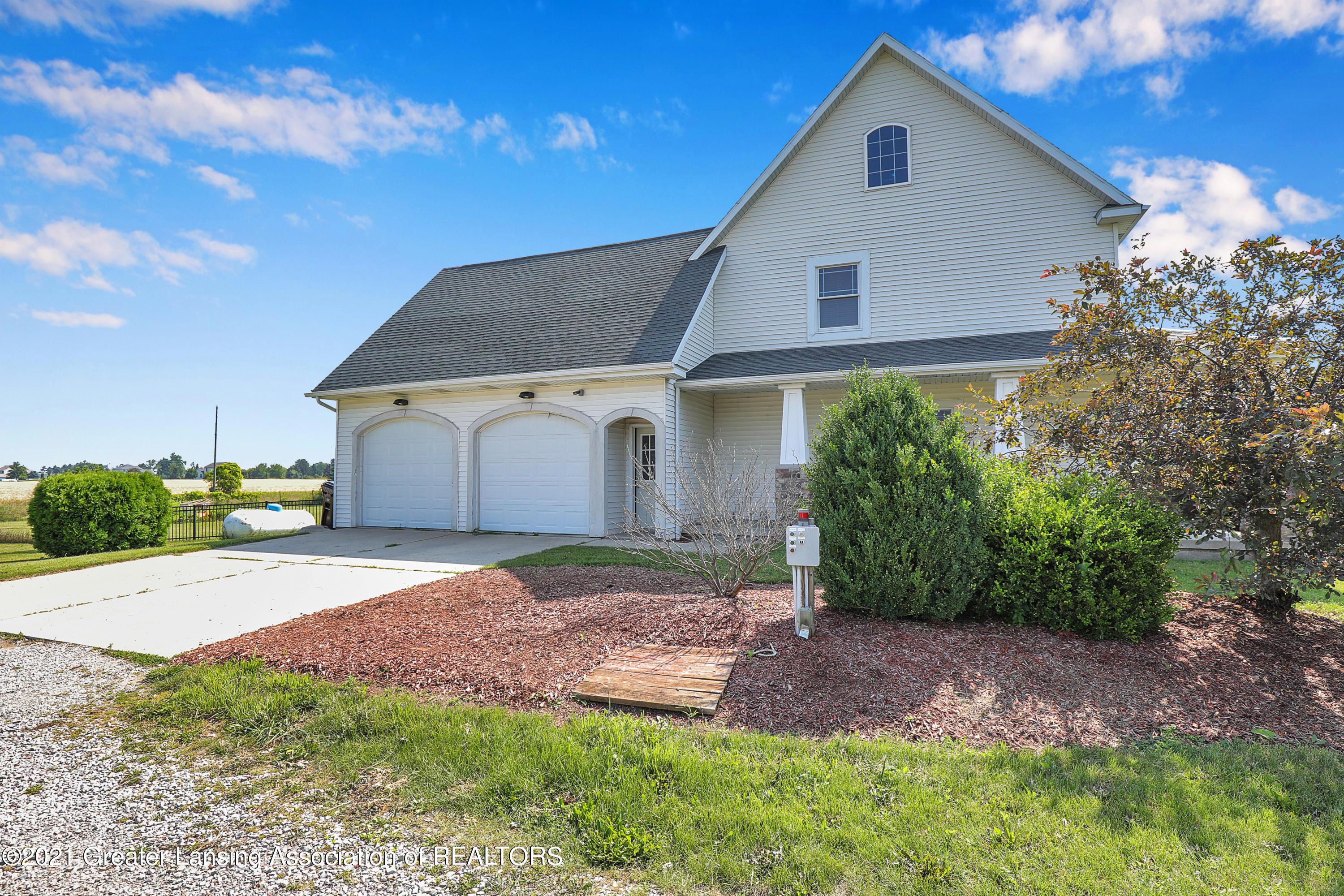 3074 Rolfe Road Mason, MI 48854 - Photo 4 of 42 Side Load Garage