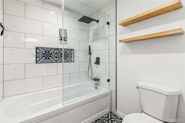 a bathroom with a shower and a toilet