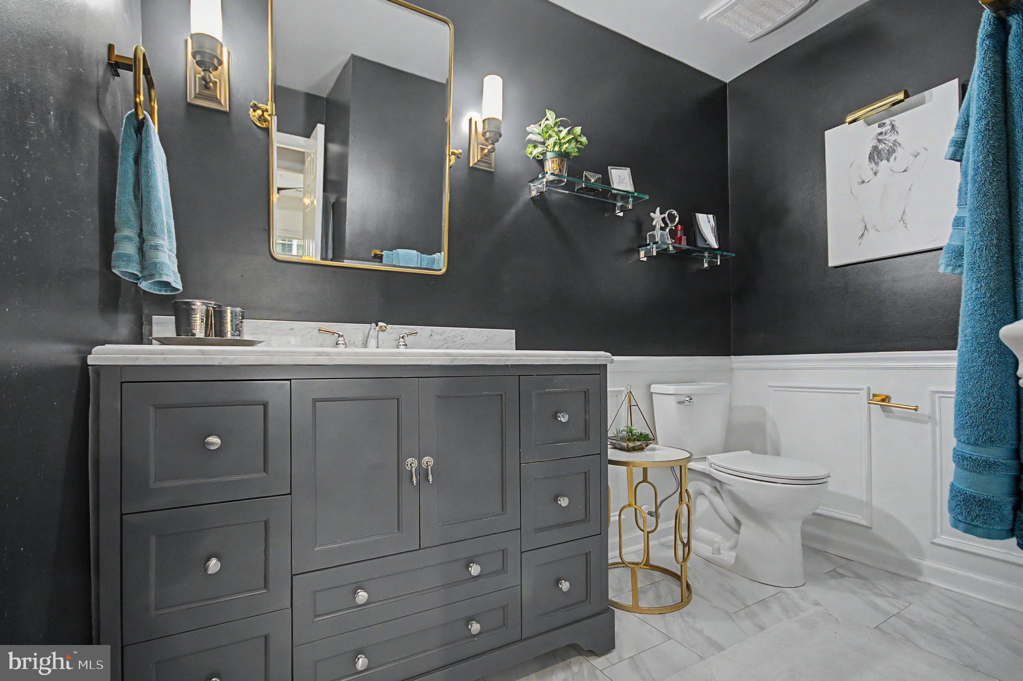 2607 Compass Drive Annapolis, MD 21401 - Photo 21 of 61 a bathroom with a toilet a sink and mirror