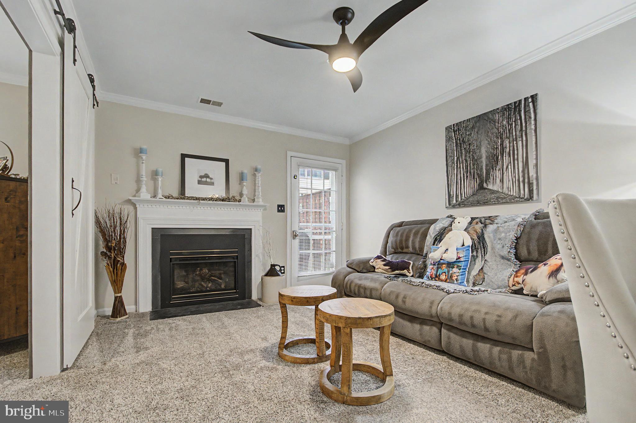 2607 Compass Drive Annapolis, MD 21401 - Photo 26 of 61 a living room with furniture and a fireplace