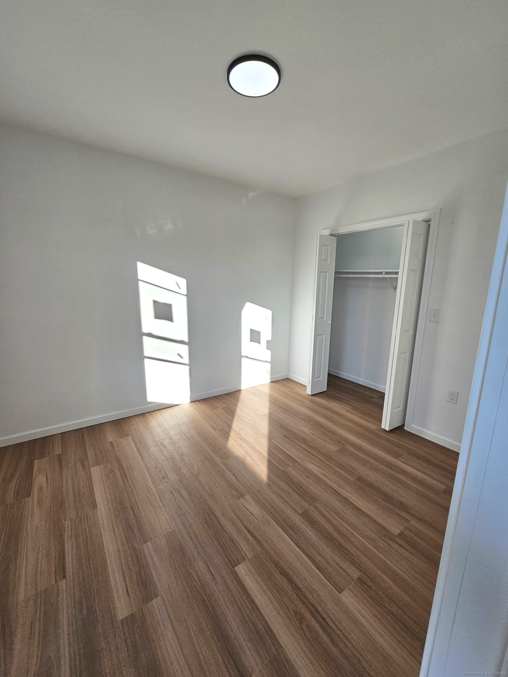 1153 Main Street, Unit 3B Windham, CT 06226 - Photo 6 of 11 Spacious, bright bedroom