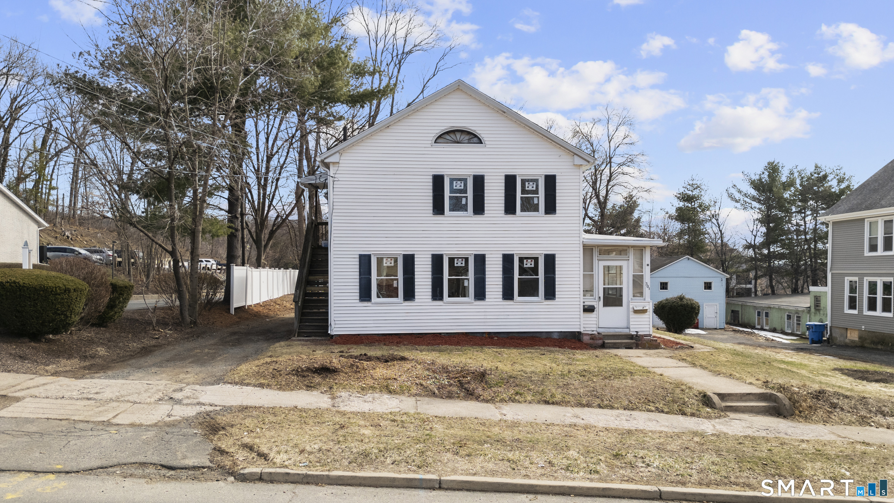 301 Queen Street Bristol, CT 06010 - Photo 1 of 26 a front view of a house with a yard