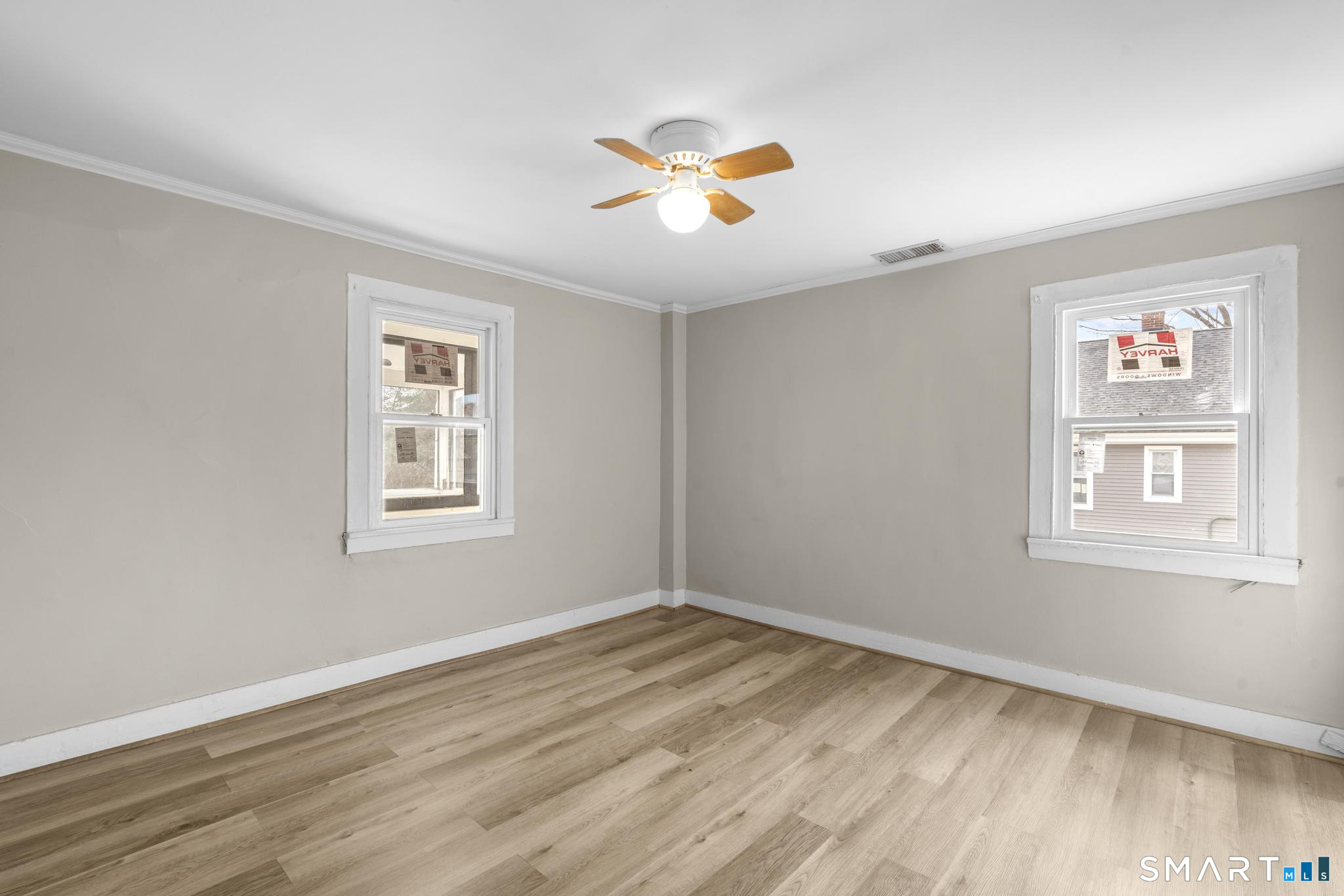 301 Queen Street Bristol, CT 06010 - Photo 20 of 26 a view of an empty room with wooden floor and a window