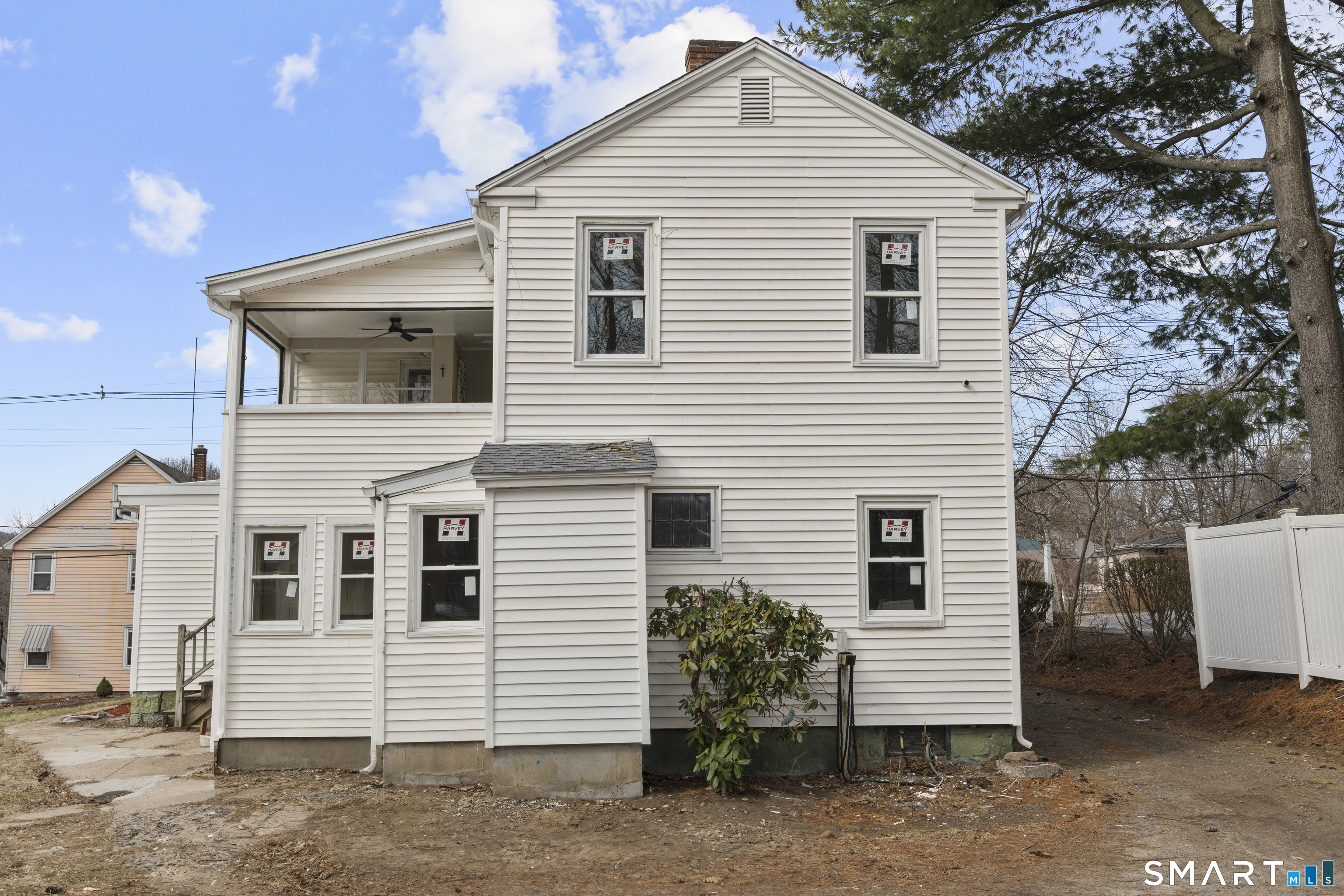 301 Queen Street Bristol, CT 06010 - Photo 5 of 26 a view of a white house with a small space
