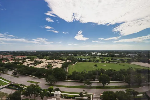 a view of a house with pool and a yard