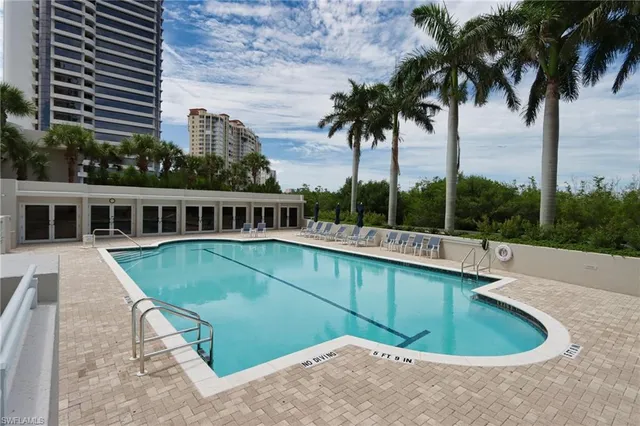 a view of a swimming pool with a balcony