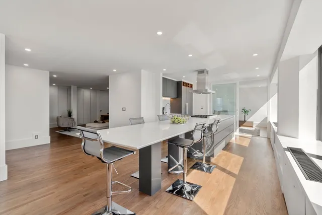 an open kitchen with a table and chairs