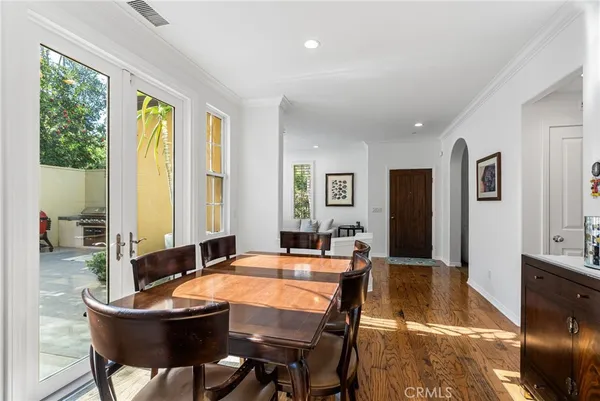 a dining room with a table and chairs