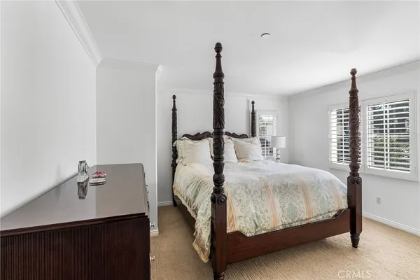 a bed room with a bed and a night stand