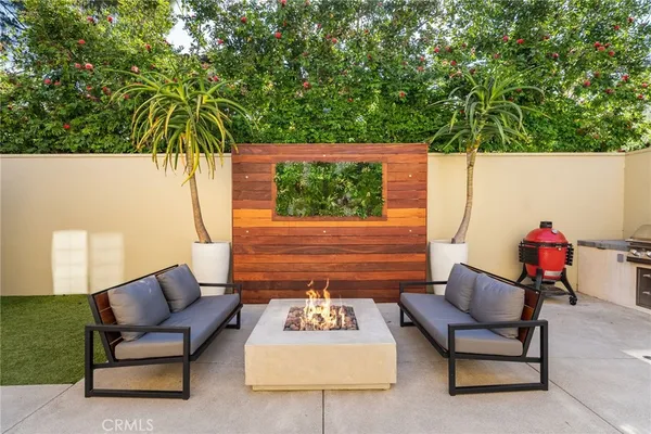 a outdoor living space with furniture and a potted plant