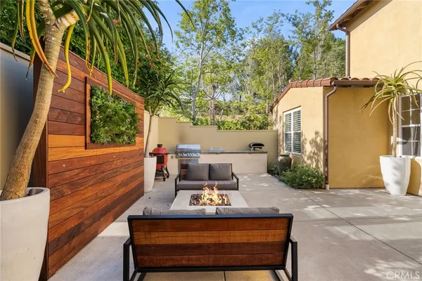 a view of a outdoor sitting area with furniture
