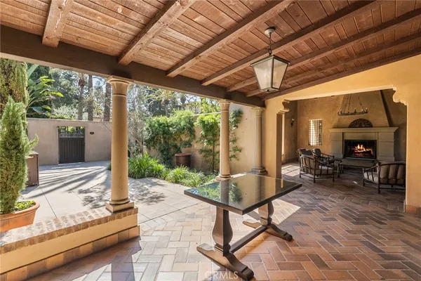 a living room with furniture a fireplace and a table