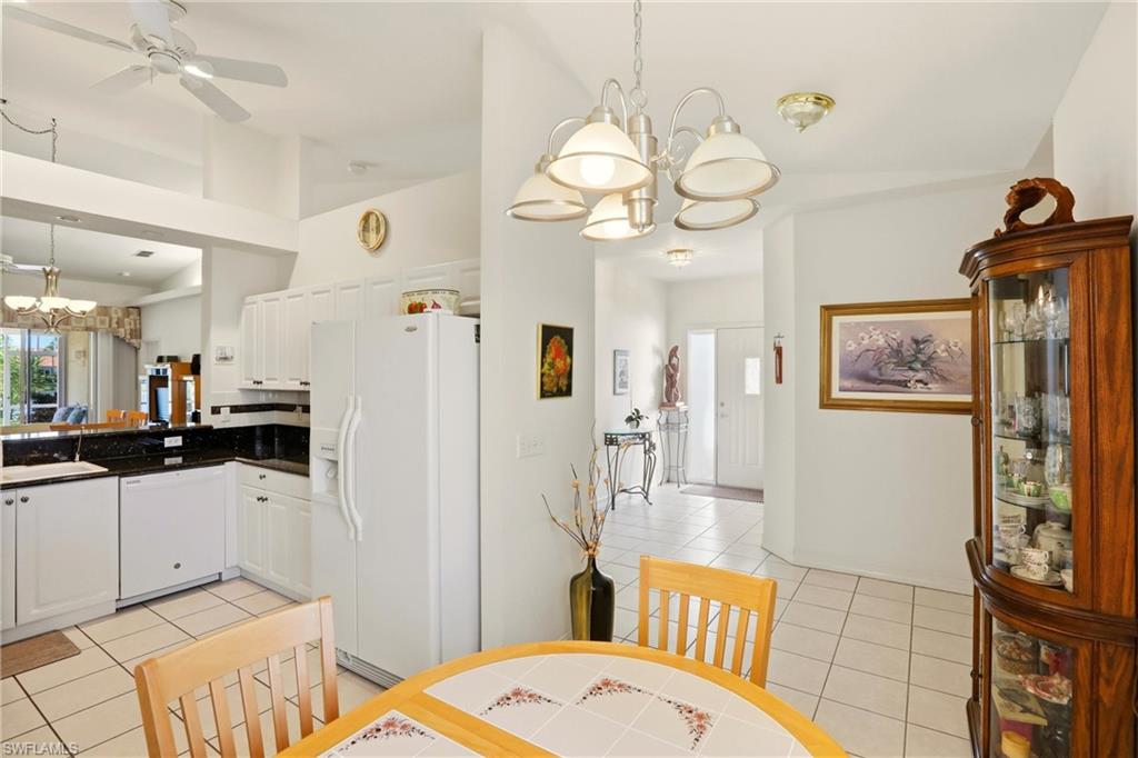 511 Joseph Court, Unit 2 Naples, FL 34104 - Photo 18 of 50 a very nice looking dining room with wooden floor
