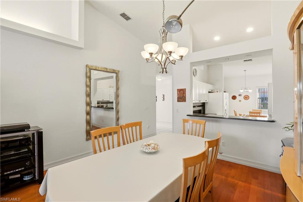 511 Joseph Court, Unit 2 Naples, FL 34104 - Photo 21 of 50 a dining room with stainless steel appliances a table and chairs