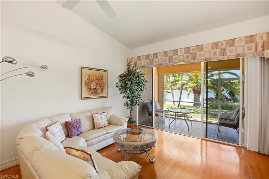 511 Joseph Court, Unit 2 Naples, FL 34104 - Photo 24 of 50 a living room with furniture and a large window