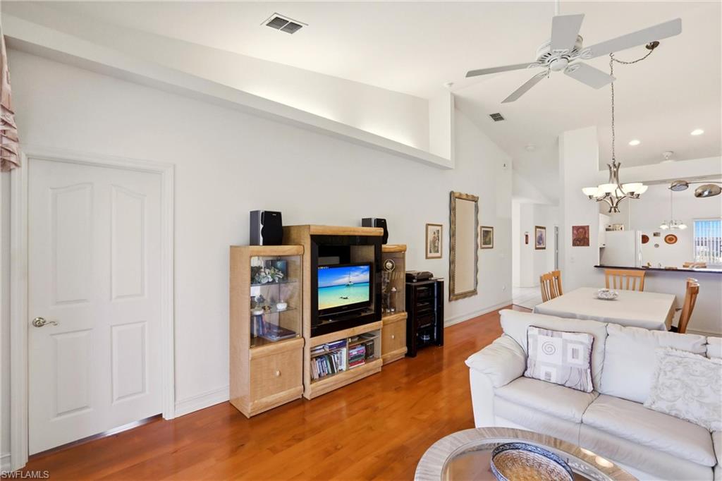 511 Joseph Court, Unit 2 Naples, FL 34104 - Photo 25 of 50 a living room with furniture and a flat screen tv