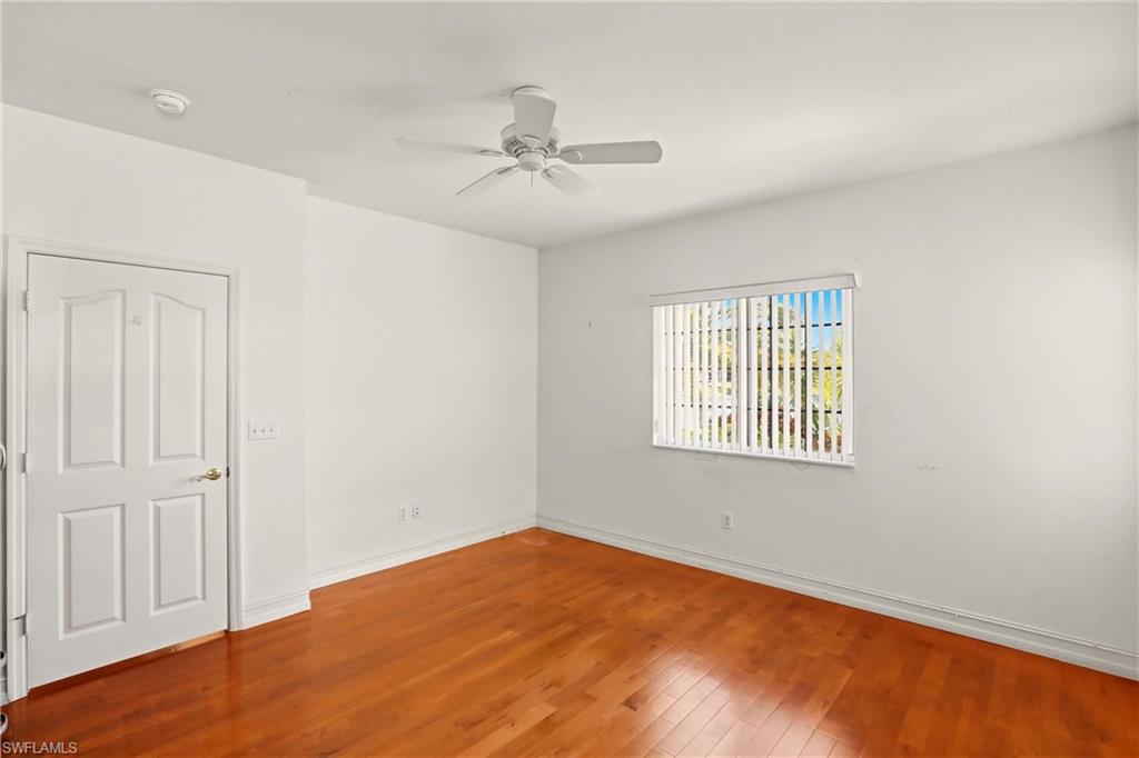 511 Joseph Court, Unit 2 Naples, FL 34104 - Photo 29 of 50 a view of an empty room with a window