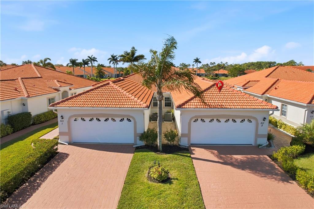 511 Joseph Court, Unit 2 Naples, FL 34104 - Photo 3 of 50 a sign on the side of a building