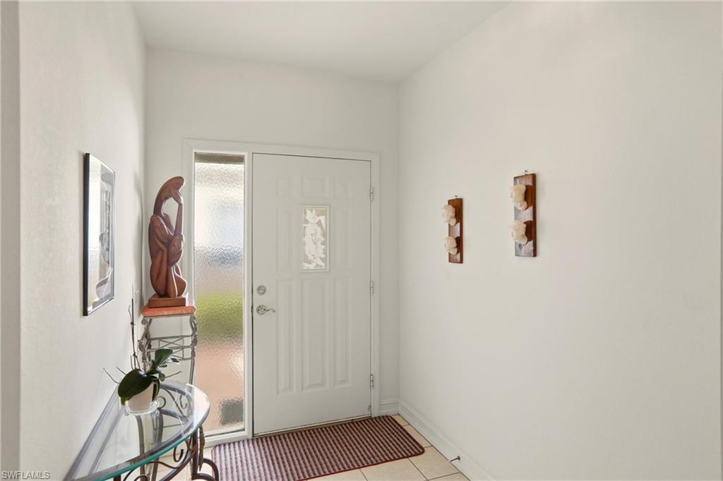 511 Joseph Court, Unit 2 Naples, FL 34104 - Photo 9 of 50 a view of a hallway with workspace