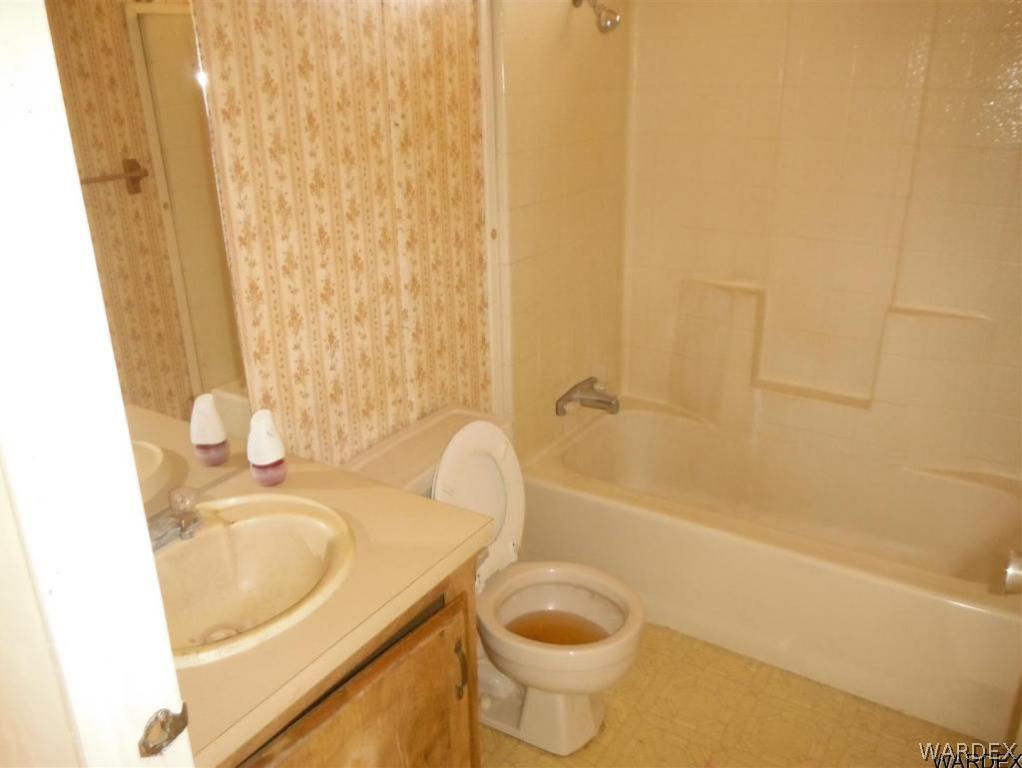 3572 Salt Road Golden Valley, AZ 86413 - Photo 16 of 17 a bathroom with a sink and a tub