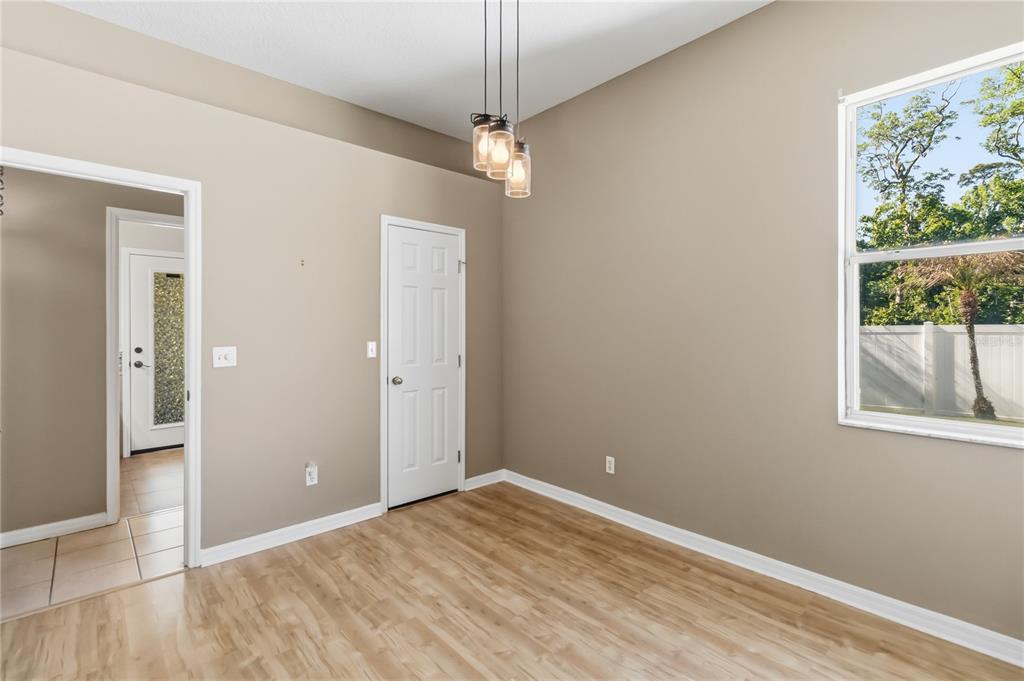 677 Buckhaven Loop Ocoee, FL 34761 - Photo 24 of 41 a view of a room with wooden floor and windows