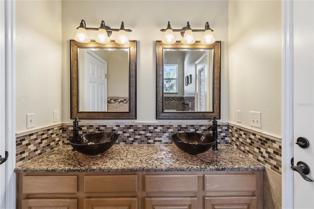 677 Buckhaven Loop Ocoee, FL 34761 - Photo 25 of 41 a bathroom with a sink and a mirror
