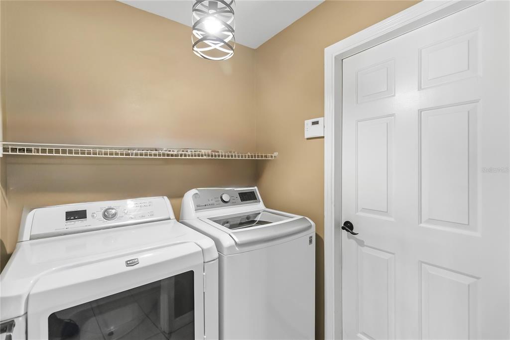 677 Buckhaven Loop Ocoee, FL 34761 - Photo 31 of 41 a utility room with dryer and washer