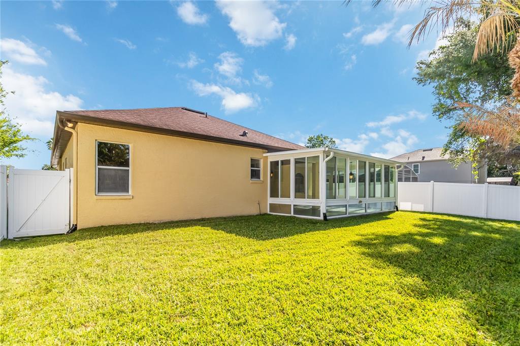 677 Buckhaven Loop Ocoee, FL 34761 - Photo 32 of 41 a view of a house with swimming pool and a yard