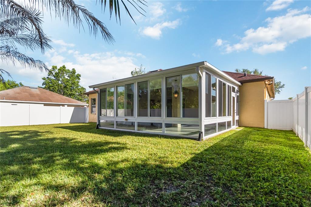 677 Buckhaven Loop Ocoee, FL 34761 - Photo 34 of 41 a view of a house with backyard and garden