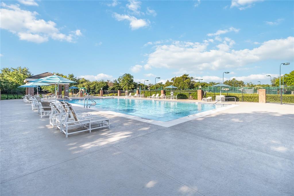 677 Buckhaven Loop Ocoee, FL 34761 - Photo 36 of 41 a view of a park with swings and slides