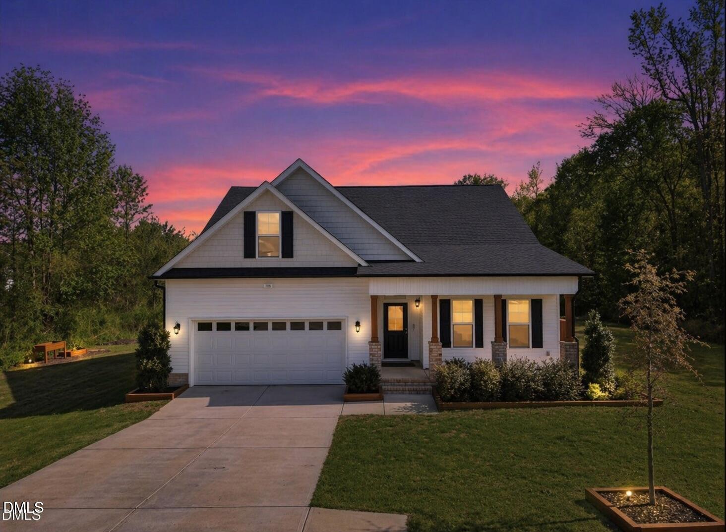 386 Howards Crossing Drive Wendell, NC 27591 - Photo 1 of 31 a front view of a house with a yard