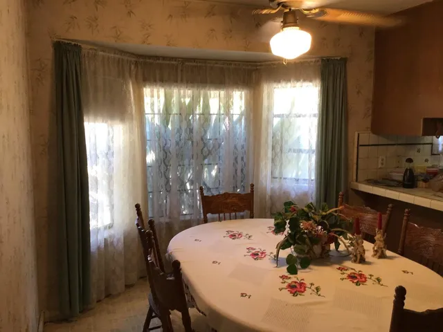 a bathroom with a bathtub a sink and mirror
