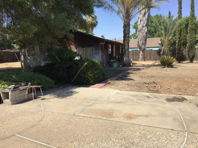 a view of a patio with a yard