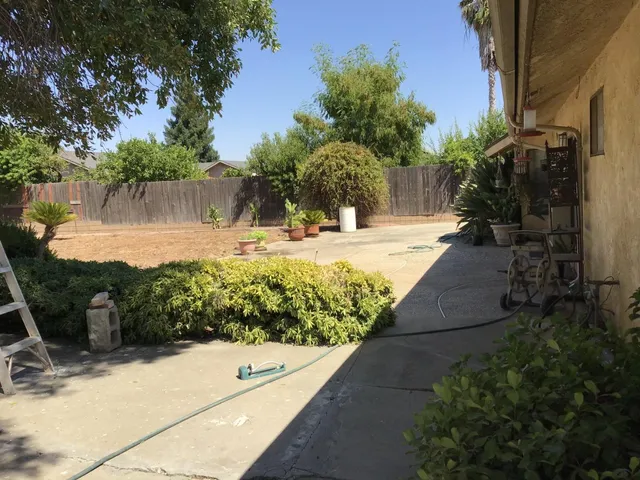 a view of a backyard of the house