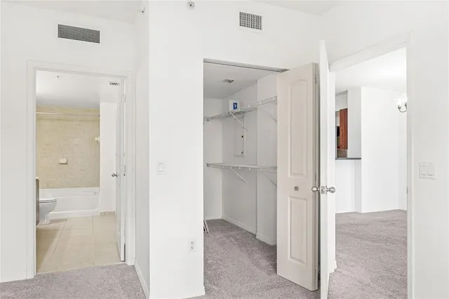 a view of a bathroom with a shower and a sink