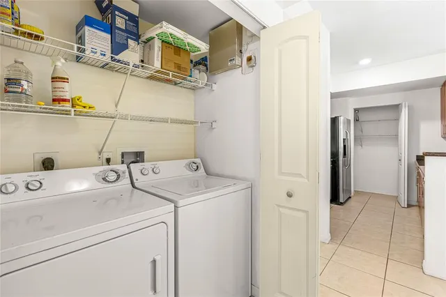 a view of storage and utility room with washer and dryer
