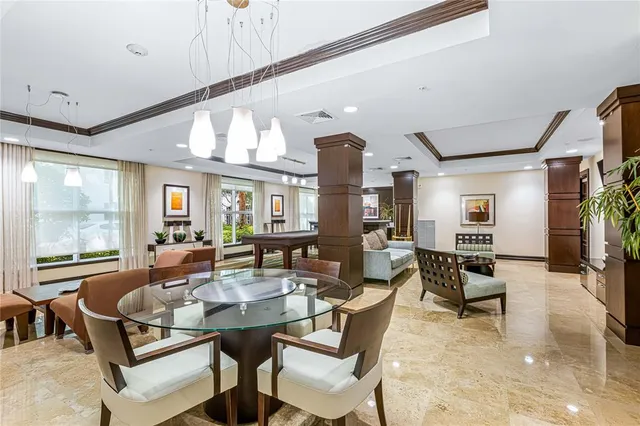 a living room with fireplace furniture and a large window