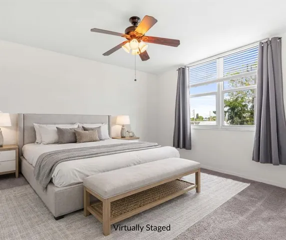 a bedroom with a bed and window