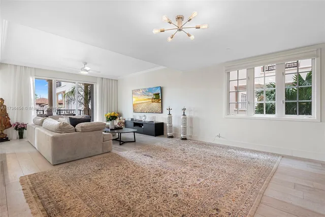 a living room with furniture and windows