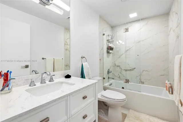 a bedroom with two beds and a large window