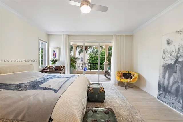 a bedroom with a large bed and a large window