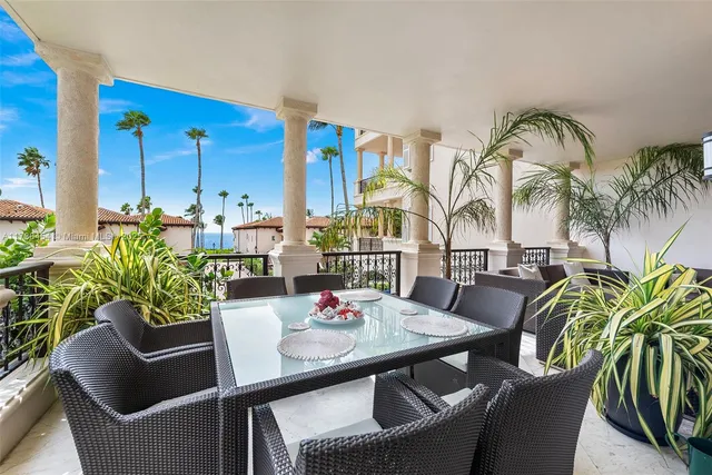 a view of balcony with furniture