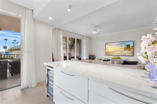 a view of living room with furniture and flat screen tv