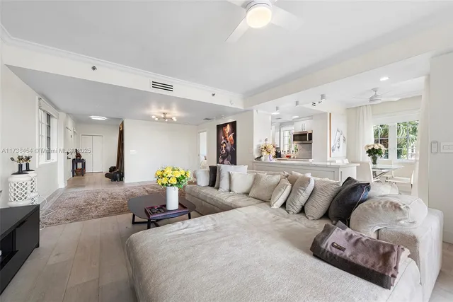 a living room with furniture and white walls