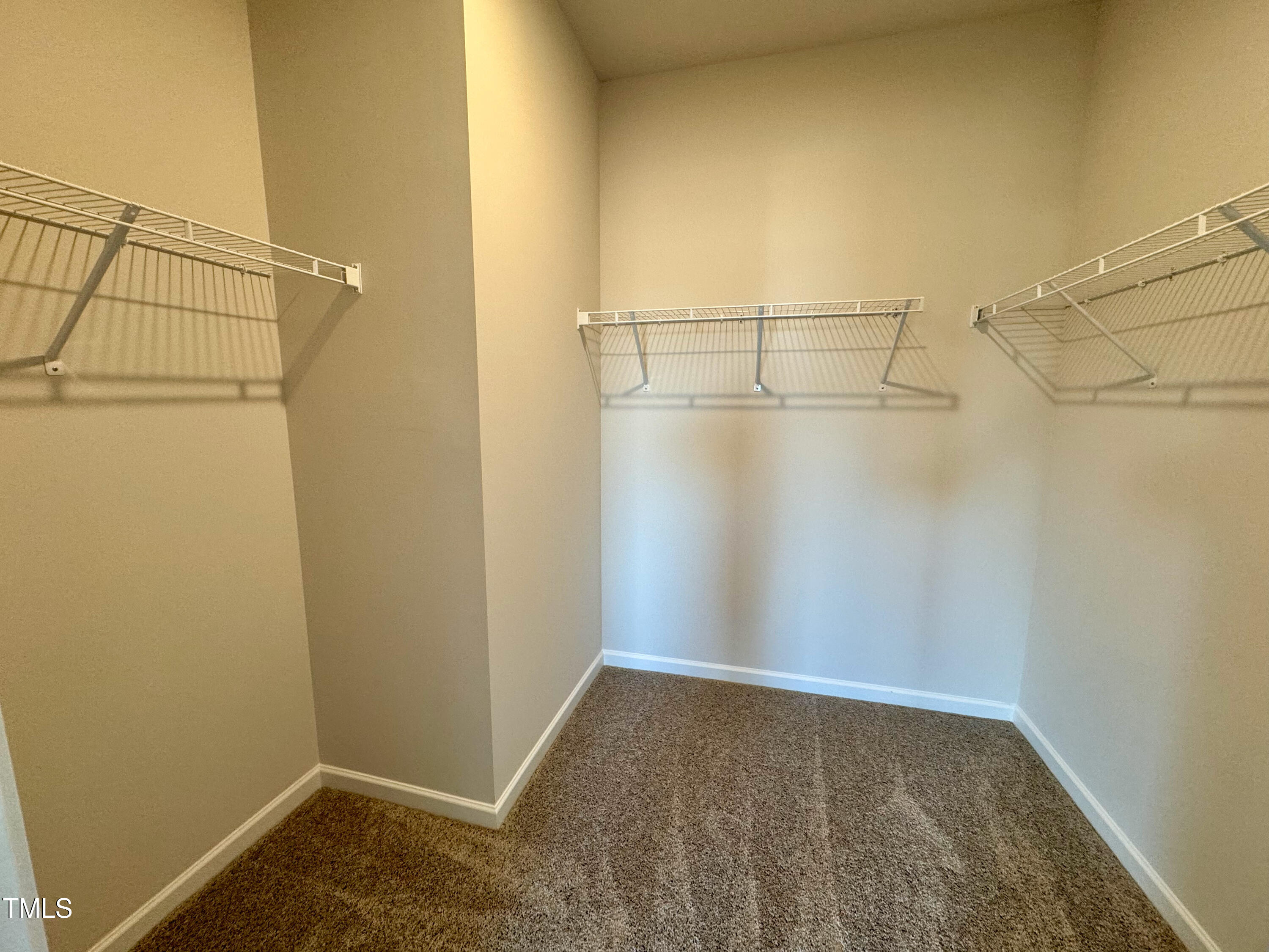 134 Commons Circle, Unit 232 Clayton, NC 27520 - Photo 14 of 37 a view of a room with racks on the wall