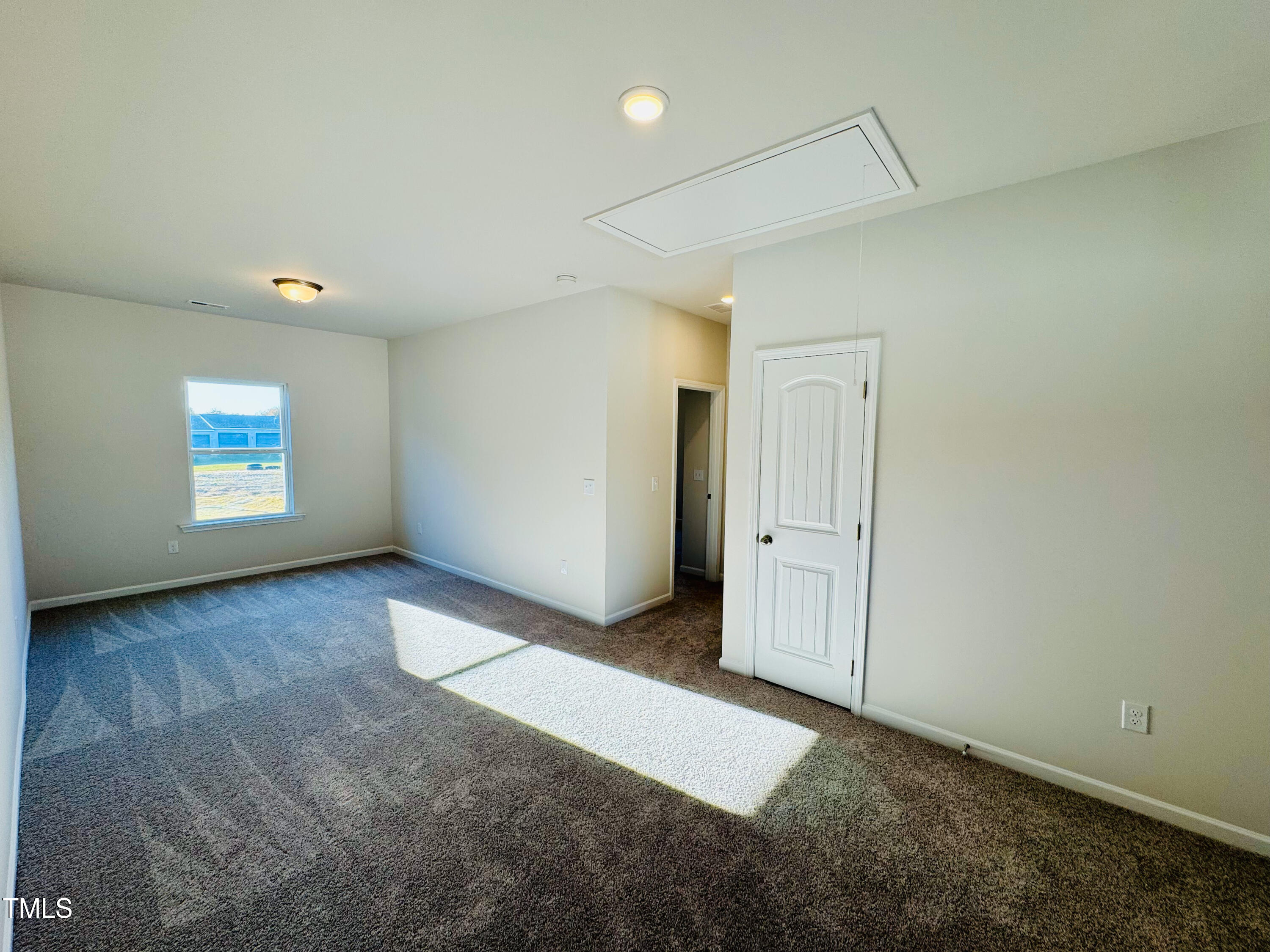 134 Commons Circle, Unit 232 Clayton, NC 27520 - Photo 10 of 37 an empty room with windows