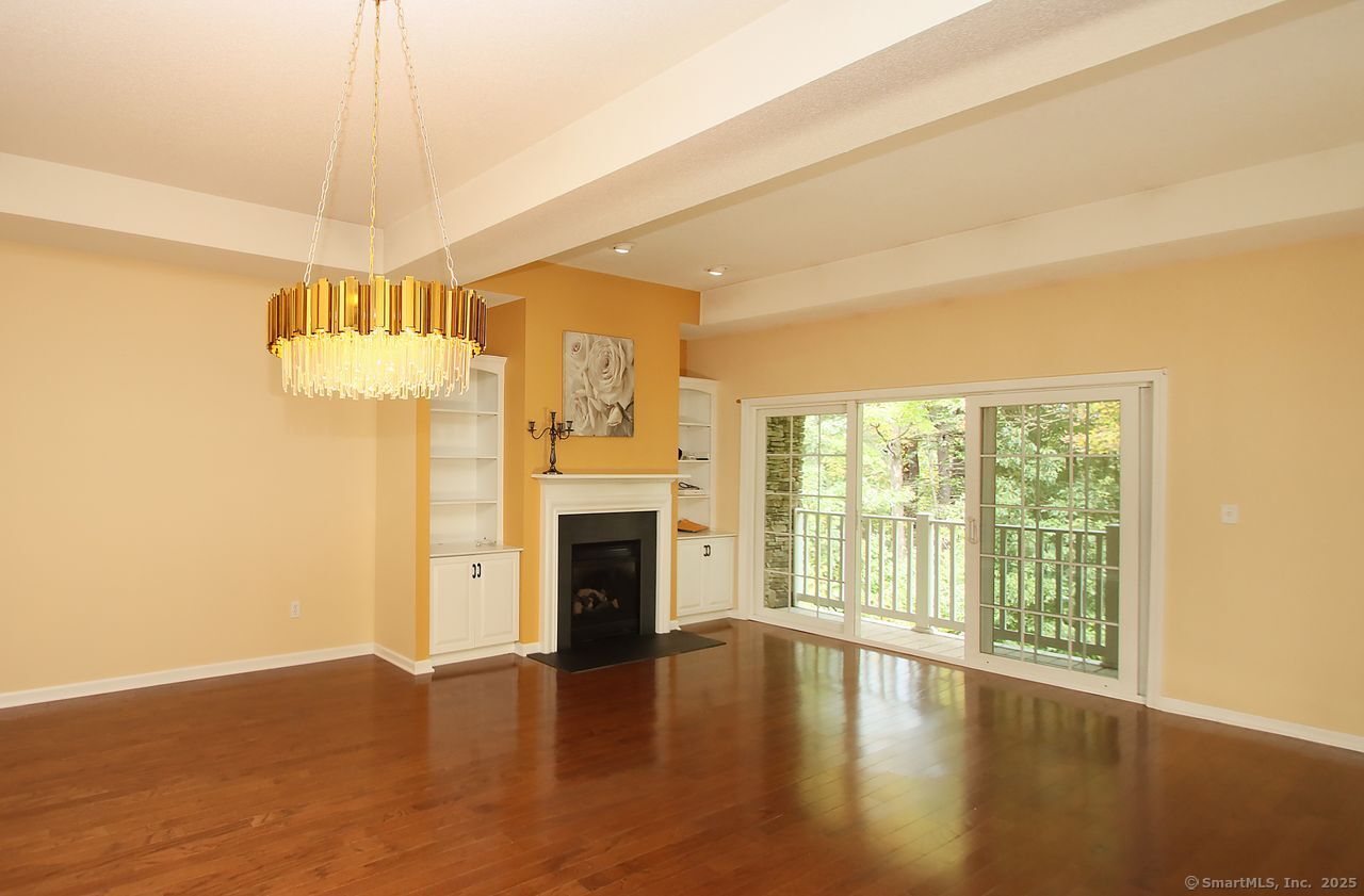 35 Todd Street, Unit 103 Hamden, CT 06518 - Photo 16 of 40 a view of an empty room with wooden floor and a window