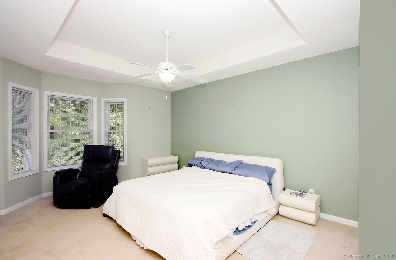 35 Todd Street, Unit 103 Hamden, CT 06518 - Photo 23 of 40 a bedroom with a bed and wooden floor