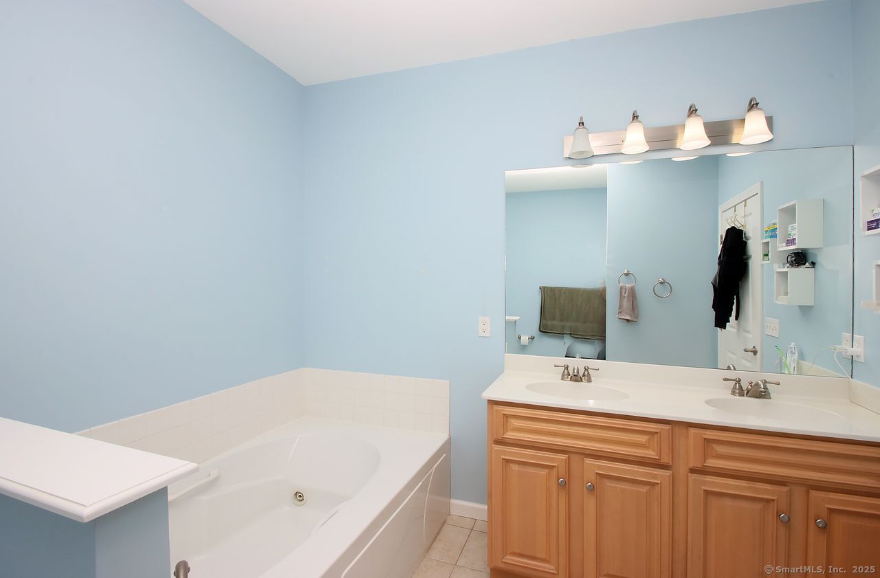 35 Todd Street, Unit 103 Hamden, CT 06518 - Photo 27 of 40 a bathroom with a sink and a mirror