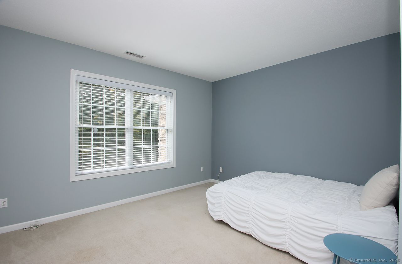 35 Todd Street, Unit 103 Hamden, CT 06518 - Photo 28 of 40 a bedroom with a bed and window